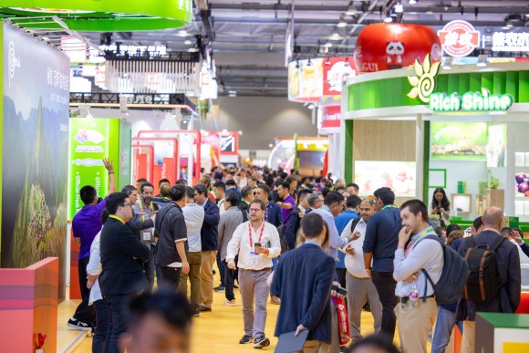 An exhibition hall full of people.
