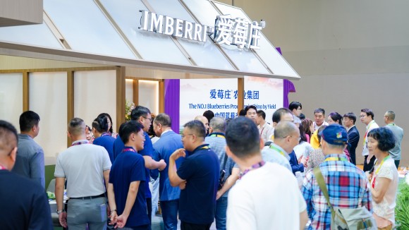 An exhibition hall full with people.