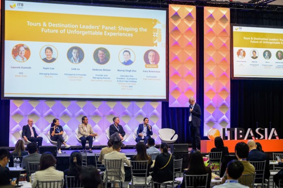 A panel discussion at ITB Asia. Behind them is a large screen displays the panel title: “Tours & Destination Leaders’ Panel: Shaping the Future of Unforgettable Experiences.