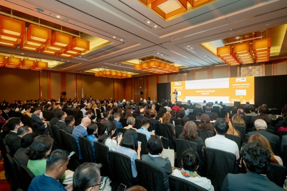 A large audience attends the opening keynote of ITB Asia 2025 , with Mr Alvin Tan delivering the opening remarks on stage.